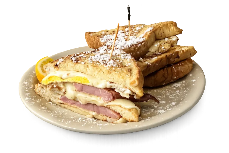 Breakfast Monte Cristo — French-toast-style ham, egg, and cheese sandwich dusted with powdered sugar
