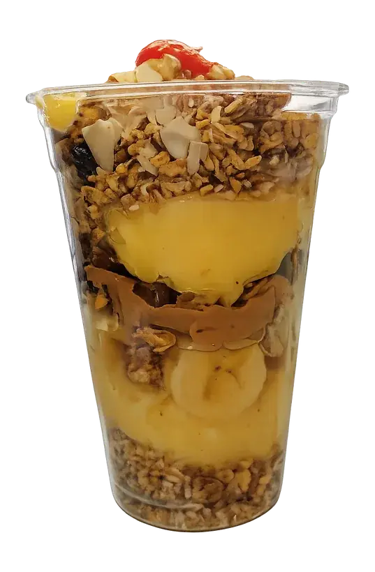 Granola parfait layered with fruit and creamy filling in a clear cup